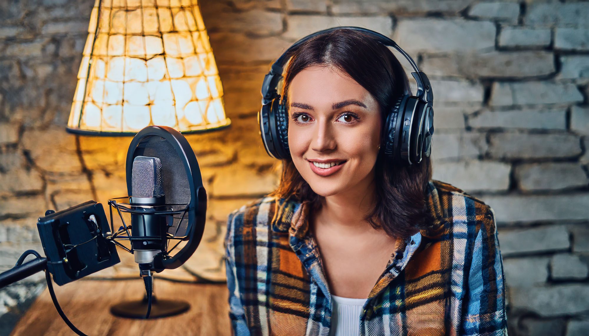 AI generated image of a female podcaster wearing heaphones.