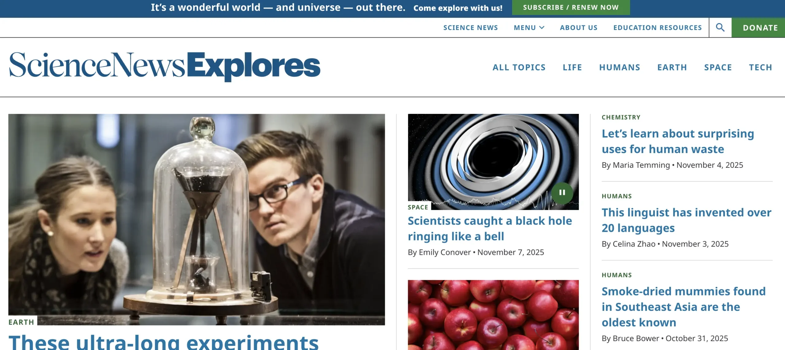 Homepage of Science News Explores showing featured science stories about black holes, human waste research, linguistics, and ancient mummies, with a large header image of scientists observing an experiment under a glass dome.