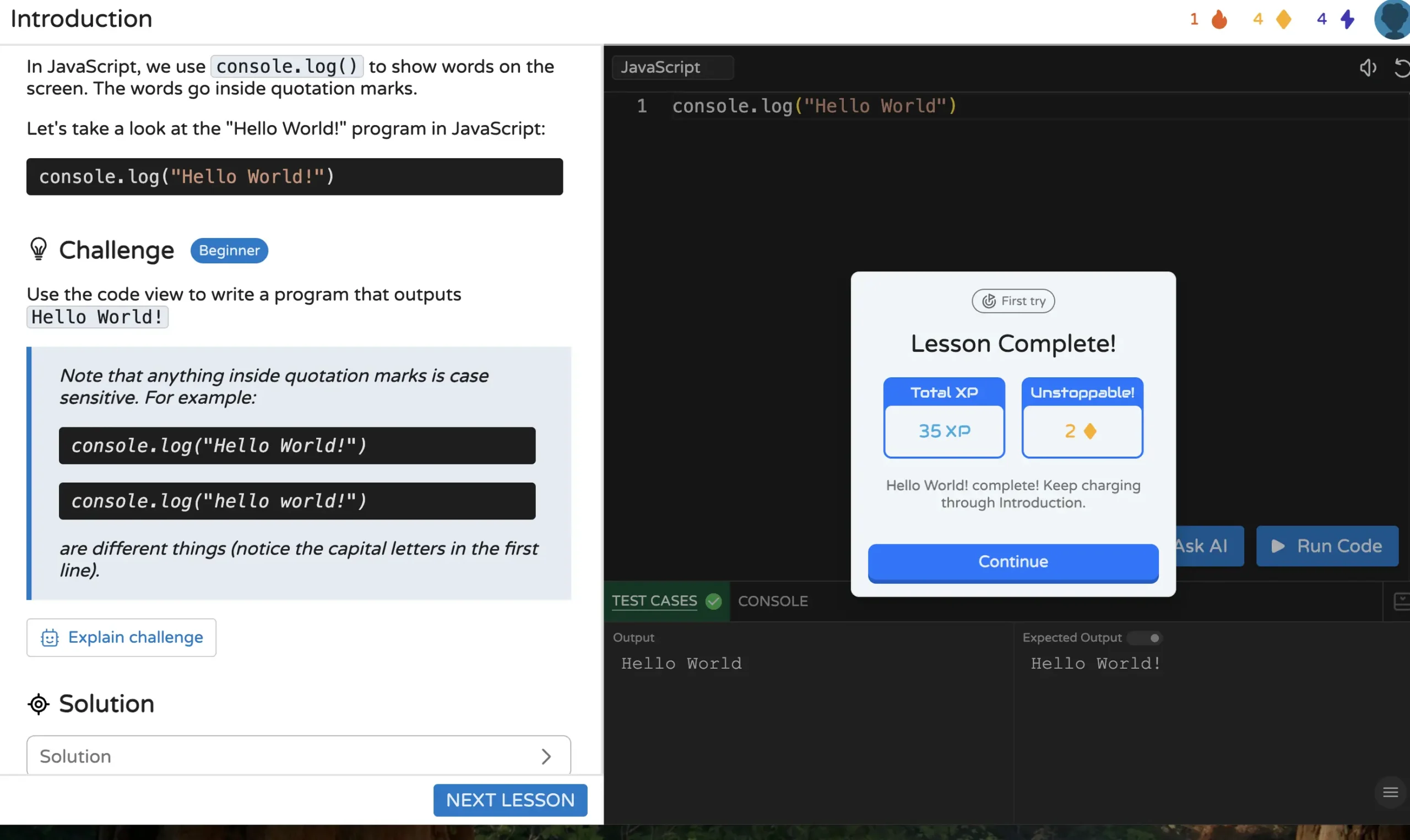 JavaScript beginner lesson showing a “Hello World” coding challenge completed successfully