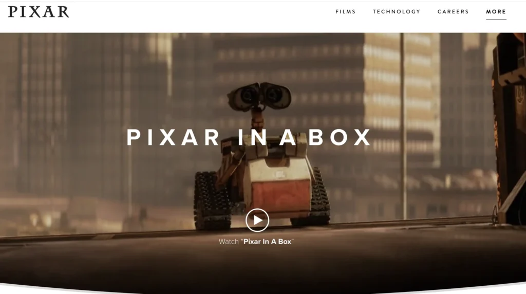 Promotional image from Pixar’s website for Pixar in a Box. The scene shows WALL·E, the animated robot character, centered on a city rooftop with large buildings in the background. The text “PIXAR IN A BOX” is overlaid, with a play button and link to watch the feature video below.